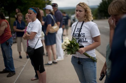 Fans like Rachel O'Brien, center, 20, of Mifflinburg, Pennsylvania, have been steadily flocking to the site since Paterno's death in January.