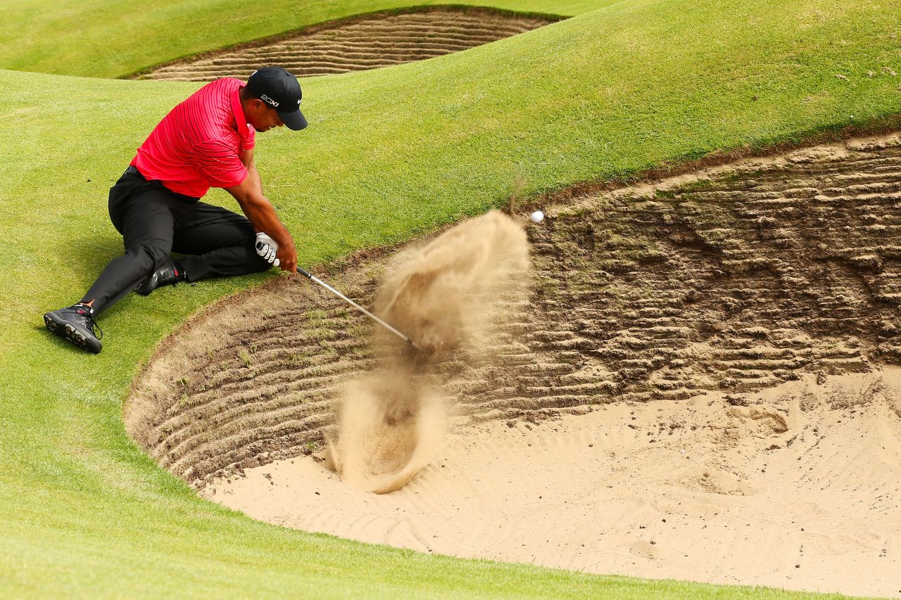 Tiger Woods of the United States tries to works his way out of a bunker on the sixth hole Sunday.