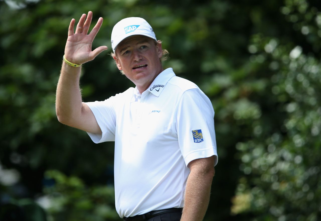 Ernie Els of South Africa, who began the day at -5, waves to spectators from the the on the first hole as he begins the final round Sunday.