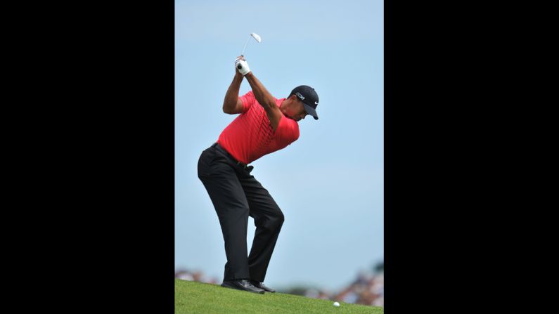 Woods, who had several bogies on the day, hits his approach shot on the second hole during the final round Sunday.