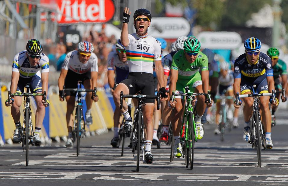 Mark Cavendish wins the stage on the Champs Elysees in 2012, his fourth straight in the French capital. He is hoping to wear yellow for the first time by taking the first stage in Normandy.