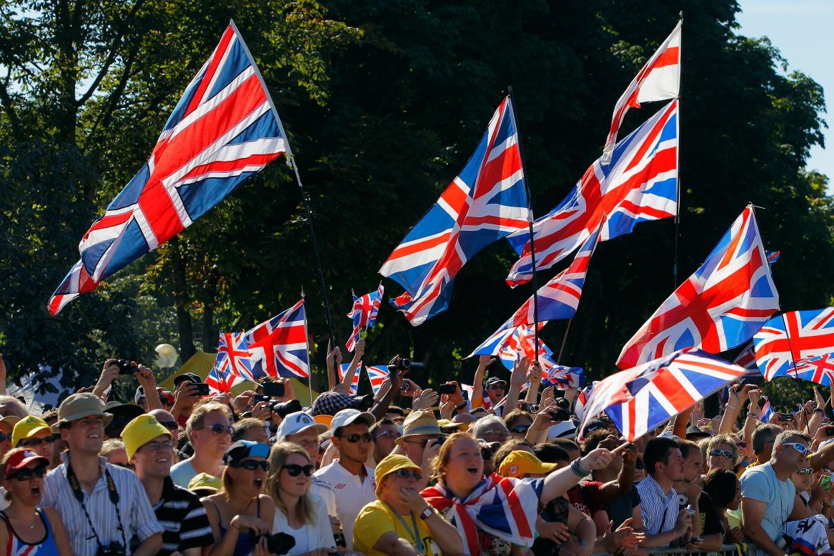 British fans celebrate during the 20th and final stage of the Tour on Sunday in Paris.