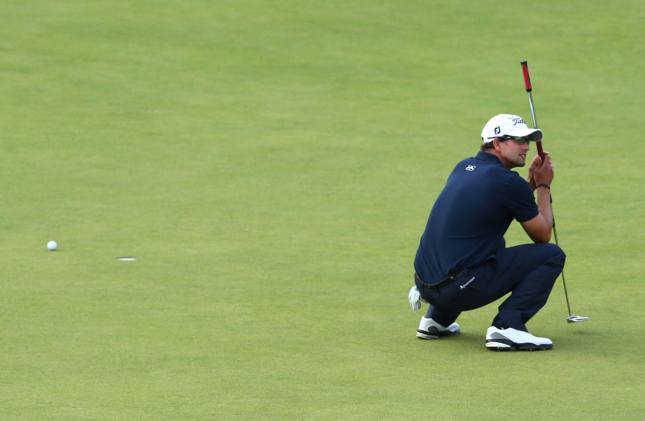Adam Scott of Australia reacts to a missed par putt on the 18th green Sunday.