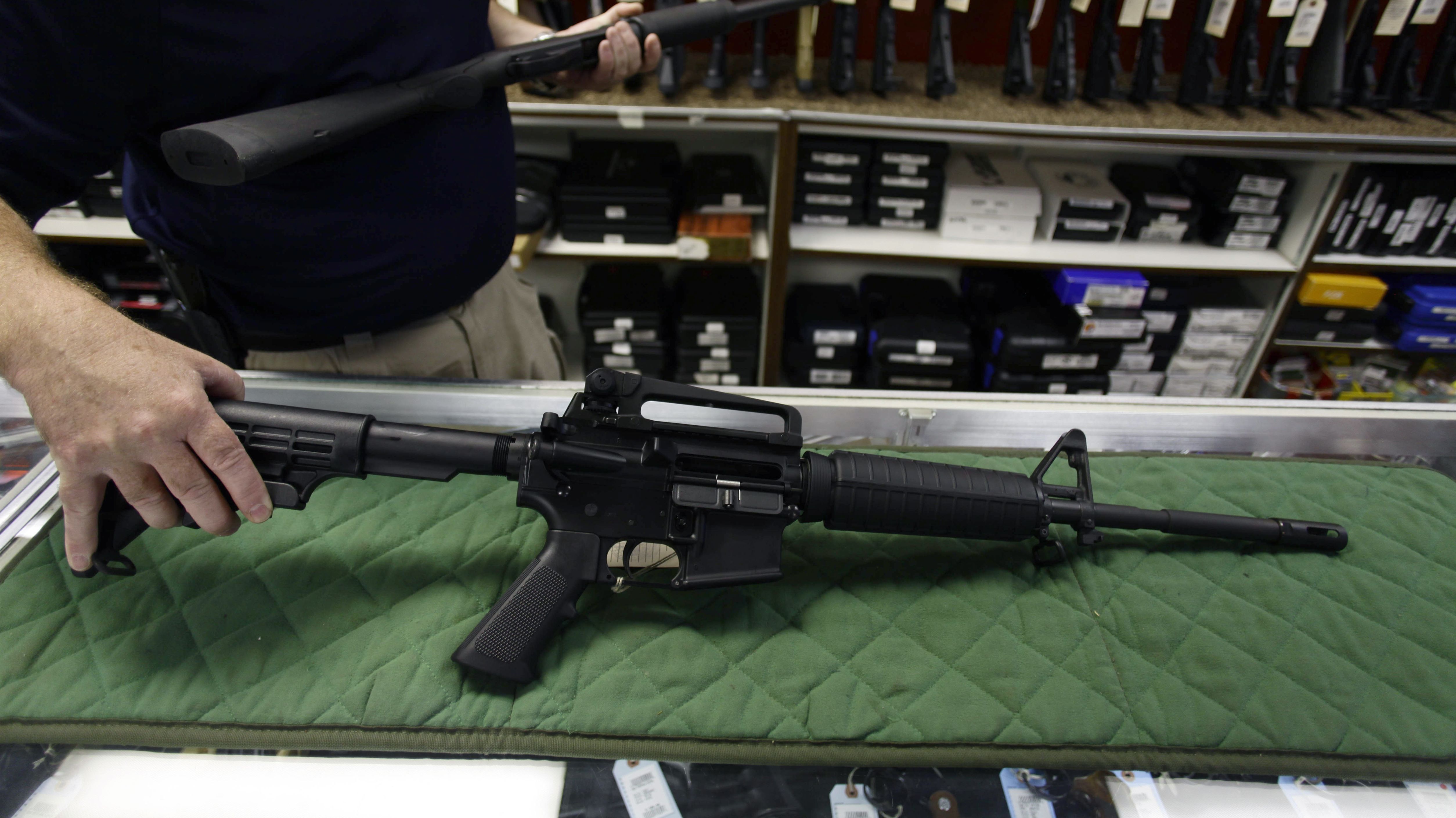 A Bush Master AR-15 assault rifle similar to one used in Friday's rampage is displayed Sunday at a gun shop in Aurora, Colorado. 