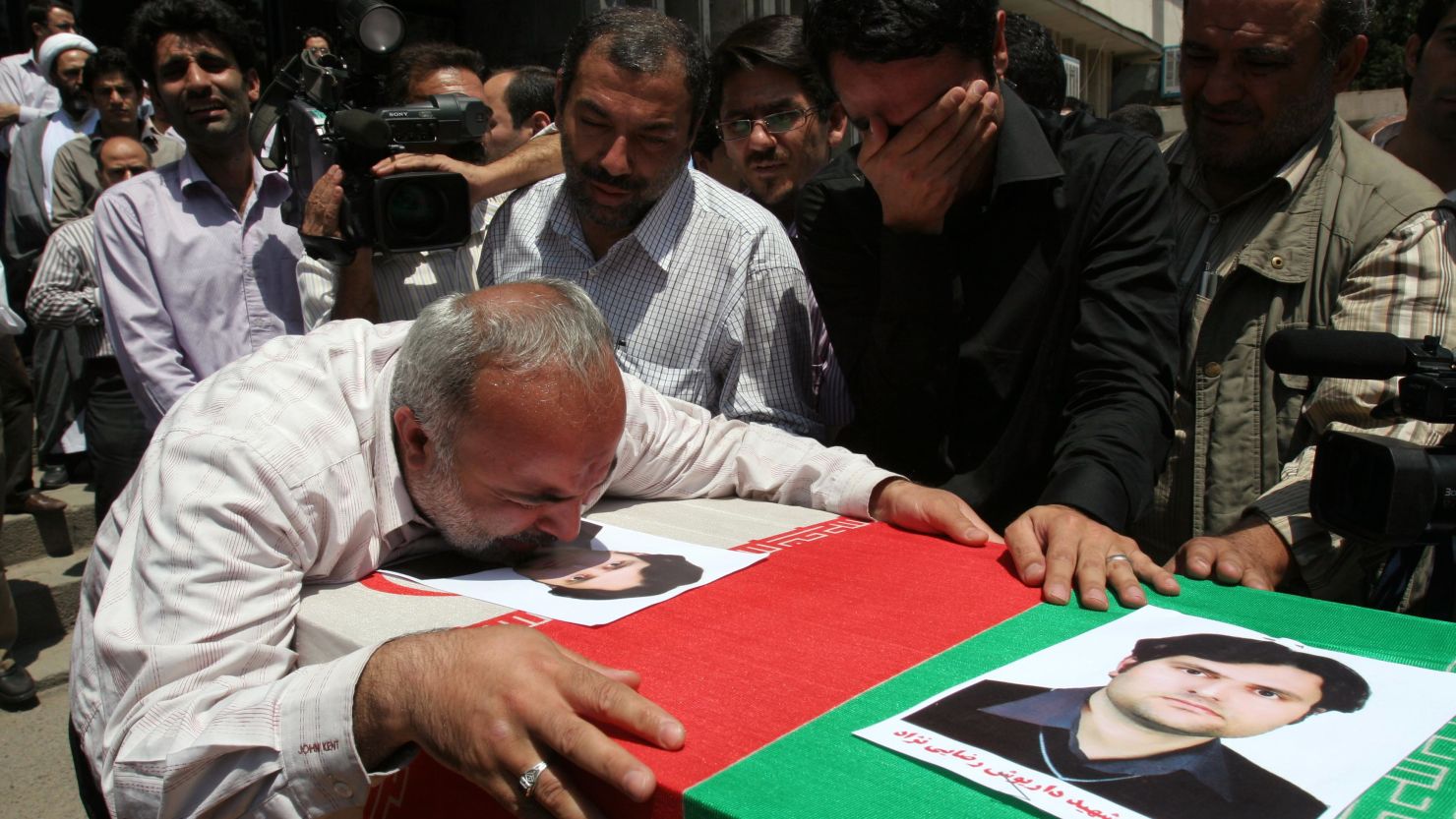 Mourners at the funeral of 35-year-old Daryoush Rezaie, the Iranian nuclear scientist who was shot dead in 2011.