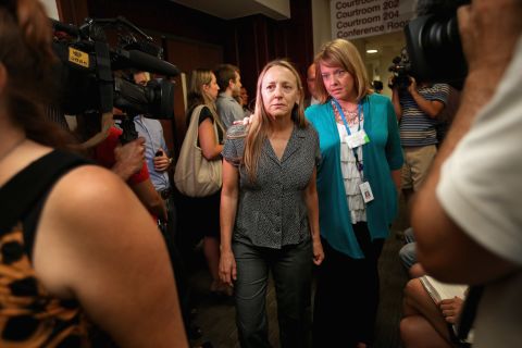 Family members of the victims arrive at the courthouse July 23, 2012, for the suspect's first court appearance.