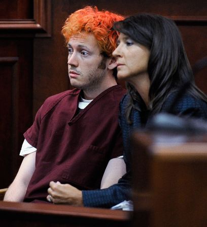 The public gets its first glimpse of James Holmes, then 24, the suspect in the Colorado theater shooting during his initial court appearance July 23, 2012. With his hair dyed reddish-orange, Holmes, here with public defender Tamara Brady, showed little emotion. He is accused of opening fire in a movie theater July 20, 2012, in Aurora, Colorado, killing 12 people and wounding 70. Holmes faces 166 counts, almost all alleging murder or attempted murder. He has pleaded not guilty by reason of insanity. <a href="index.php?page=&url=http%3A%2F%2Fwww.cnn.com%2F2012%2F07%2F21%2Fus%2Fgallery%2Fcolorado-mourning-victims%2Findex.html" target="_blank">More photos: Mourning the victims of the Colorado theater massacre</a>