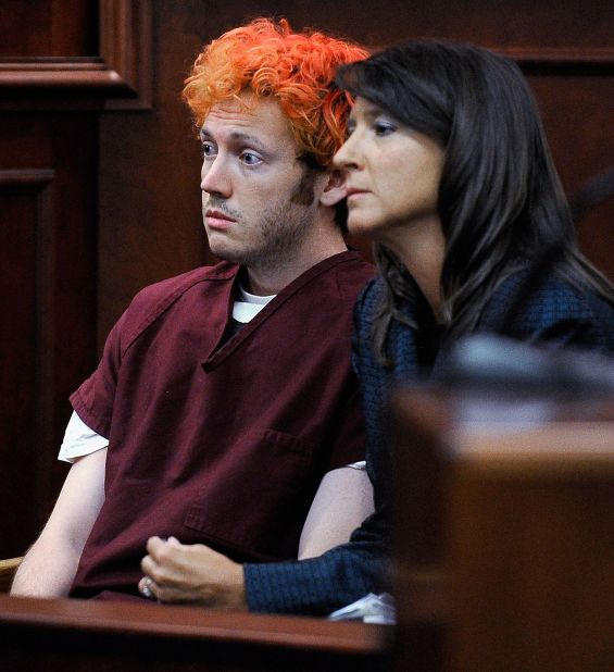 The public gets its first glimpse of James Holmes, then 24, the suspect in the Colorado theater shooting during his initial court appearance July 23, 2012. With his hair dyed reddish-orange, Holmes, here with public defender Tamara Brady, showed little emotion. He is accused of opening fire in a movie theater July 20, 2012, in Aurora, Colorado, killing 12 people and wounding 70. Holmes faces 166 counts, almost all alleging murder or attempted murder. He has pleaded not guilty by reason of insanity. <a href="http://www.cnn.com/2012/07/21/us/gallery/colorado-mourning-victims/index.html" target="_blank">More photos: Mourning the victims of the Colorado theater massacre</a>