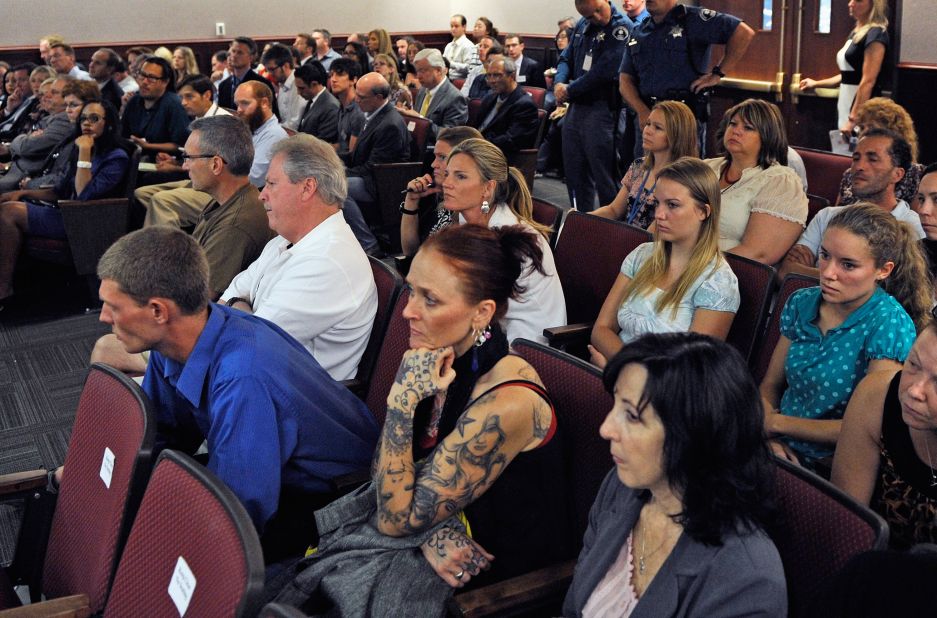 Victims and their relatives and journalists watch the proceedings in 2012.