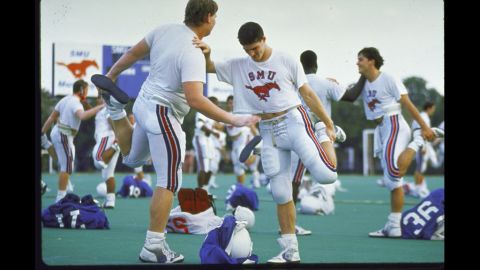 The Southern Methodist University football team warms up in 1988, two years after a scandal broke that SMU boosters had been giving football players thousands of dollars from a slush fund with university officials' knowledge. In what was the first and last time it gave the "death penalty" to a football program, the NCAA suspended SMU from playing its 1987 season and banned it from recruiting. The school also was not allowed to play at home in the 1988 season and lost dozens of scholarships.