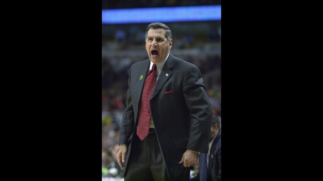 Jim Harrick Sr., then head coach of the University of Georgia Bulldogs, yells from the sidelines during the 2002 NCAA Division I men's basketball tournament. Harrick resigned as UGA's head basketball coach in 2003 after his son, Jim Harrick Jr., was accused of giving an A to three basketball players who didn't attend class and paying a phone bill for one of them. The NCAA punished UGA with four years' probation, and the school was forced to vacate 30 wins from 2001-2003.