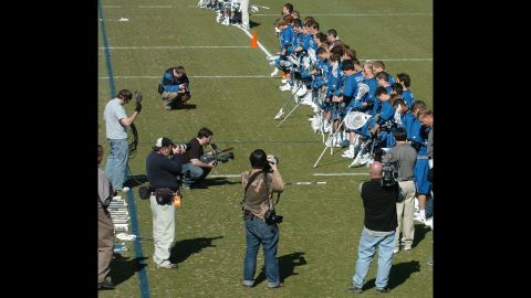 Members of the Duke men's lacrosse team listen to the national anthem at their season opener in 2007. In 2006, members of the team hired stripper Crystal Mangum for a party, and she accused three players of raping her. The scandal forced the cancellation of the men's lacrosse season that year and the resignation of team coach Mike Pressler. The allegations later proved to be false, and prosecutor Mike Nifong was disbarred for ethics violations.