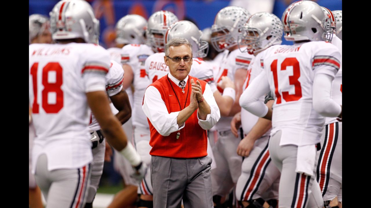 Head coach Jim Tressel with his Ohio State Buckeyes at the 2011 Sugar Bowl. Tressel admitted he knew several star players were trading memorabilia for cash and tattoos in violation of NCAA rules. The NCAA banned the Buckeyes from postseason play for the upcoming season, and OSU voluntarily vacated all 2010 wins. Tressel "resigned" in May 2011, a move OSU later deemed a retirement.
