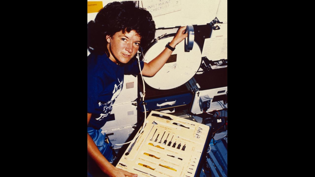 Ride inspects a tool kit during orbit. She also traveled to space aboard the Challenger in 1984. She had been assigned to a third flight as well, but that was scratched after the deadly Challenger explosion in 1986.