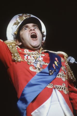 Elton John became known for his over-the-top costumes and theatrical performances.
