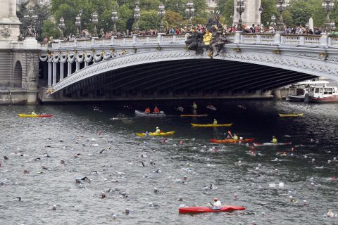 At the same 1900 Olympics, obstacle course swimmers had to negotiate boats and poles. Today the River Seine is more likely to accomodate triathletes in the city's annual competition.