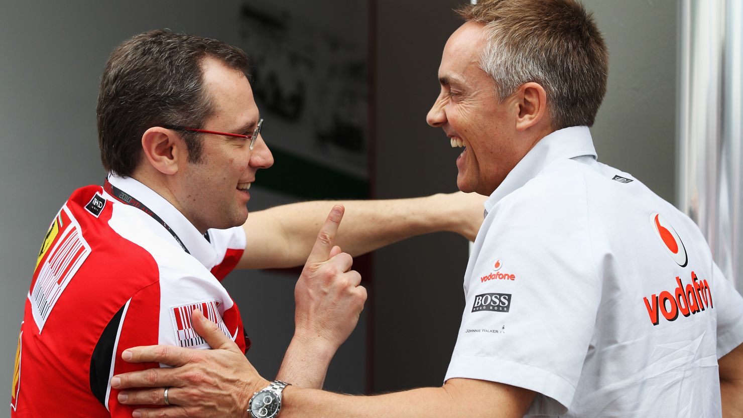 Ferrari team principal Stefano Domenicali, left, talks with McLaren counterpart Martin Whitmarsh in March 2010.