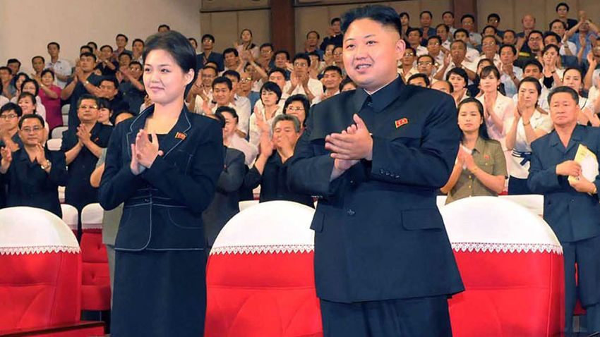 FILES) This file picture taken on July 6, 2012 by North Korean official Korean Central News Agency and released on July 9 shows North Korean leader Kim Jong Un (C), accompanied by a young woman (L), enjoying a demonstration performance given by the newly organized Moranbong band in Pyongyang. North Korean state television on July 25, 2012 confirmed that leader Kim Jong-Un is married and named his wife as Ri Sol-Ju, South Korea's unification ministry said. South Korea's unification ministry said it appeared that Ri was the woman who has been pictured several times at Kim's side at public events in recent weeks. AFP PHOTO / KCNA via KNS / FILES ---EDITORS NOTE--- RESTRICTED TO EDITORIAL USE - MANDATORY CREDIT 'AFP PHOTO / KCNA VIA KNS' - NO MARKETING NO ADVERTISING CAMPAIGNS - DISTRIBUTED AS A SERVICE TO CLIENTS (Photo credit should read KNS/AFP/GettyImages) 
