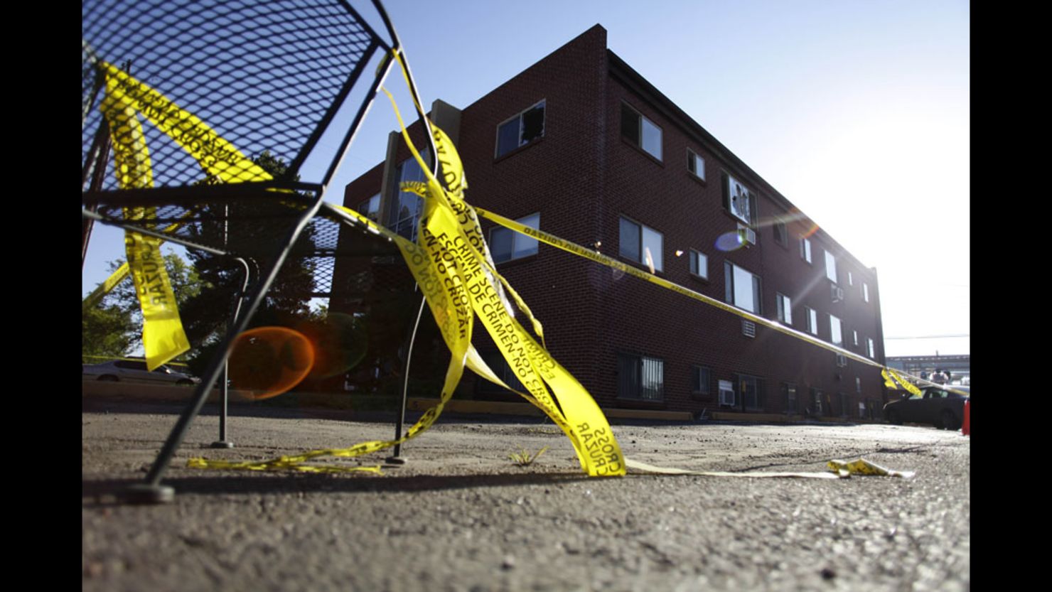 Yellow crime scene tape surrounds the apartment building where suspect James Holmes lived.
