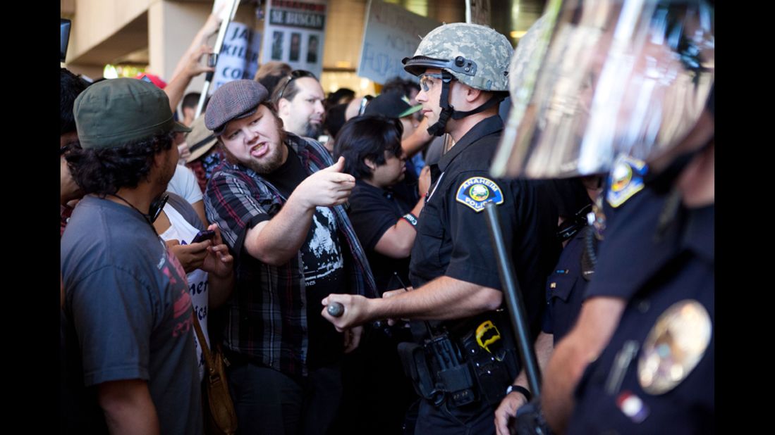 Protesters clash with police outside Anaheim City Hall.