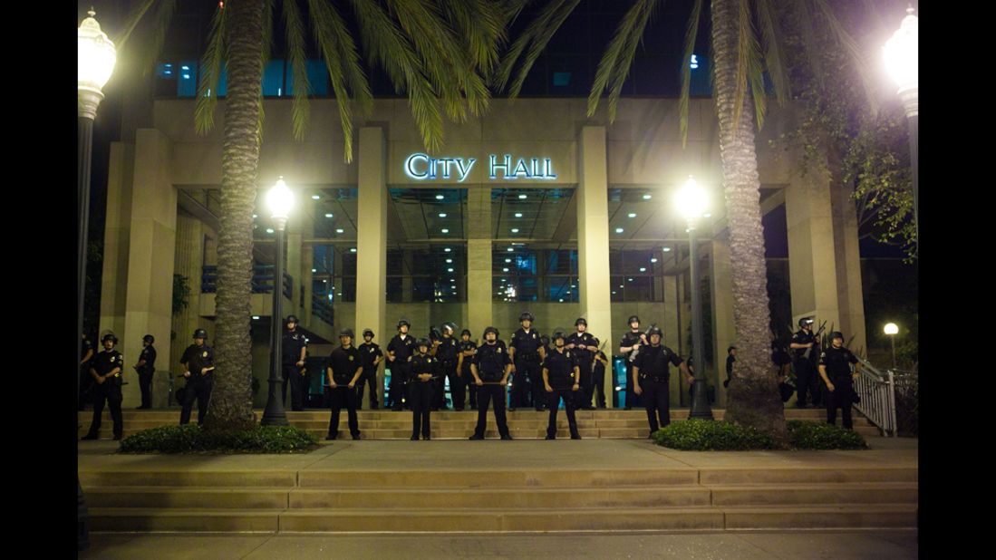 Officers stand guard in front of City Hall.