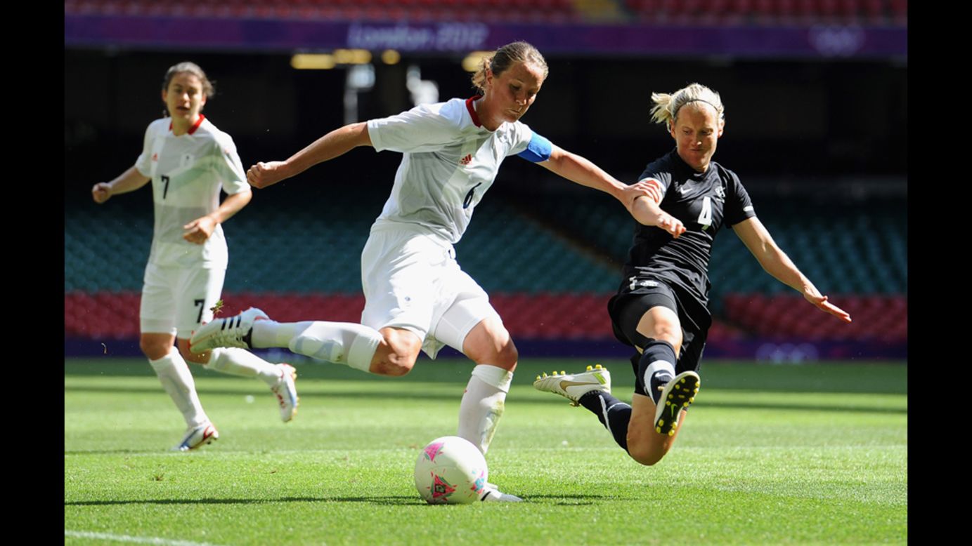 Casey Stoney of Great Britain goes up against Katie Hoyle of New Zealand.