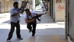 Fighters from the Syrian opposition clash with forces loyal to President Bashar al-Assad, in the center of Syria's restive northern city of Aleppo on July 25, 2012.