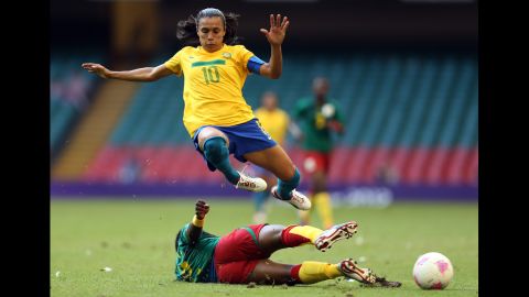 Brazil's Marta, No. 10, is tackled by Christine Manie of Cameroon during the first-round women's soccer match on July 25.