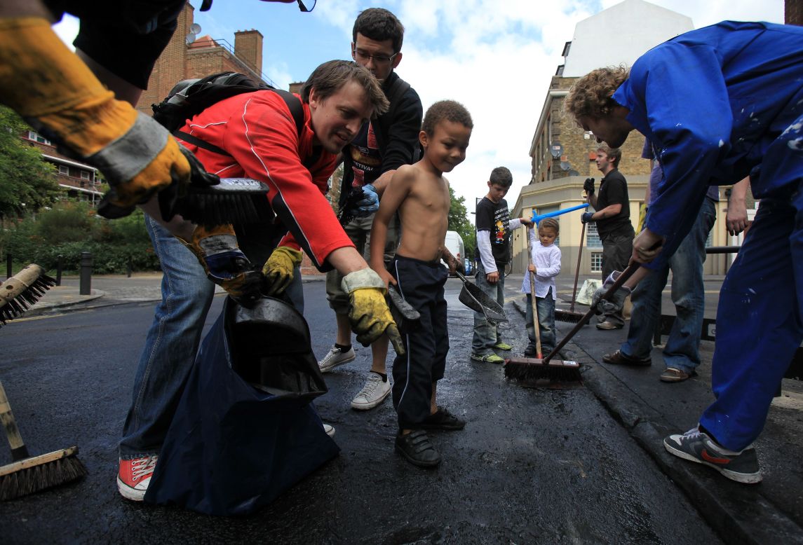 But the day after, when hundreds of volunteers turned up with brooms to help clean up east London's broken neighborhoods, showed an extraordinary sense of community.