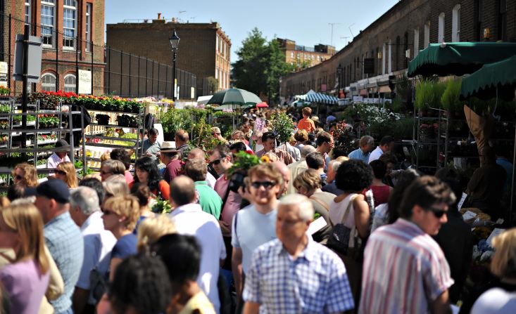 Virtually anything you could want is just a bus ride away in London. Here, shoppers fill the Columbia Road flower market near Hackney Road.