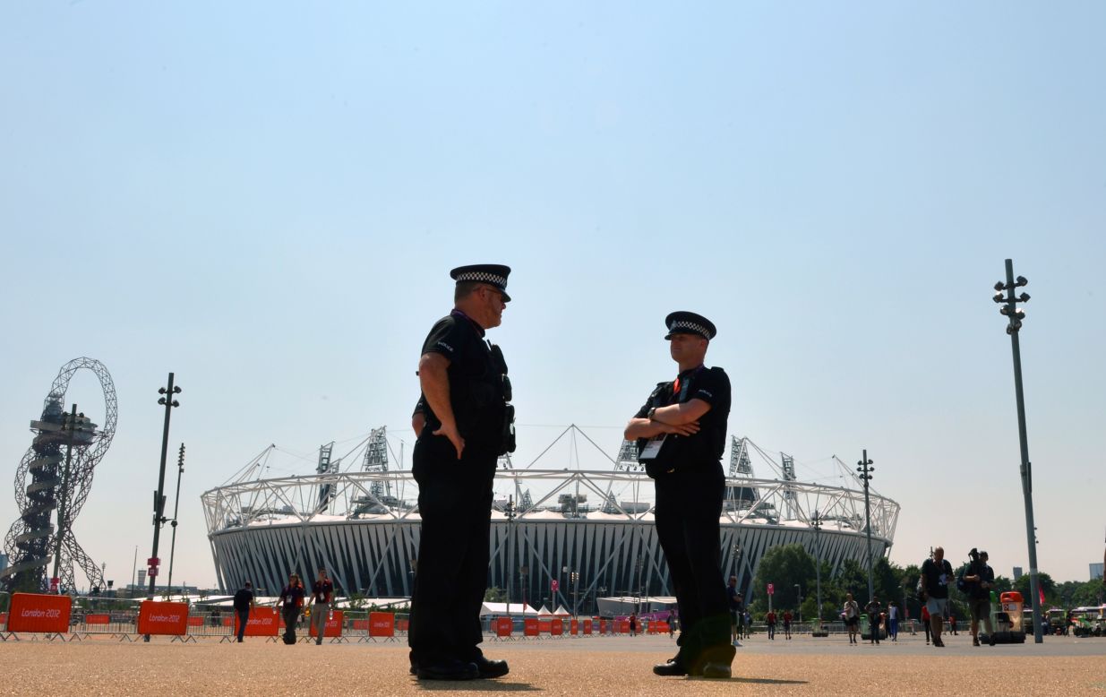 Security personnel patrol in front of Olympic Park in London on Thursday, a day ahead of the opening ceremony.  Security concerns surfaced when a private contractor failed to provide enough staff. As a result, the government is deploying 18,200 troops to remedy the shortfall.