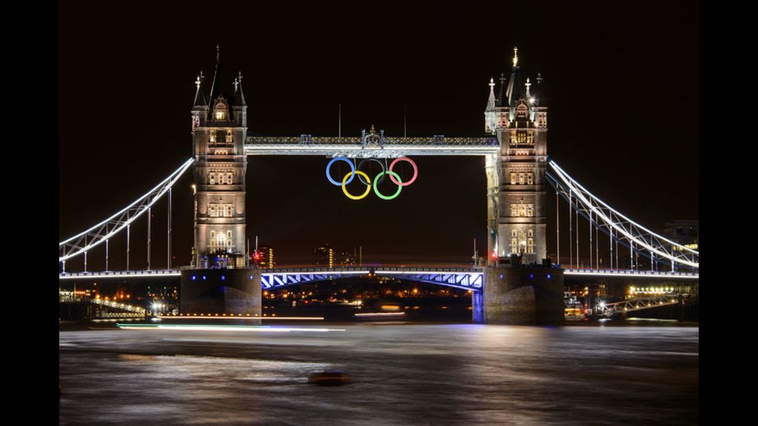 Tower Bridge, adorned with the Olympic rings, is seen late Wednesday, two days before the official start of the London 2012 Olympic Games.