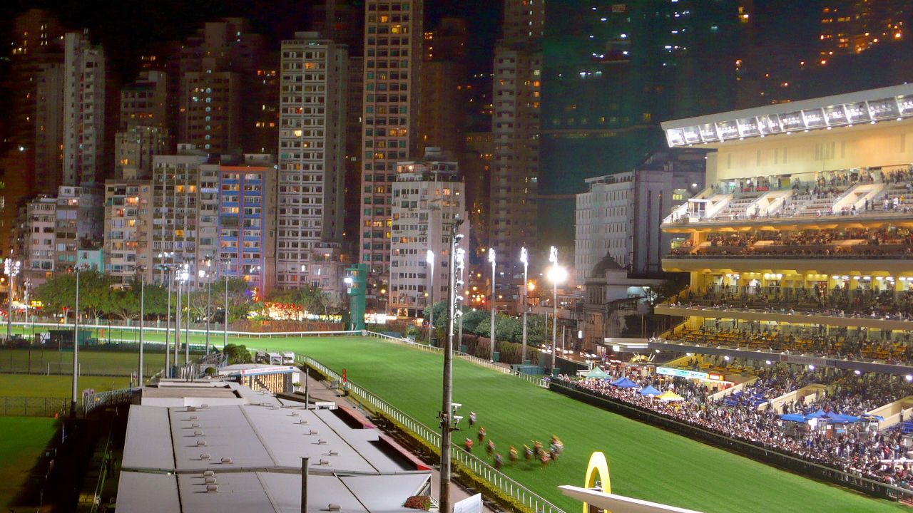 Happy Valley Racecourse is surrounded by giant apartments and skyscrapers.