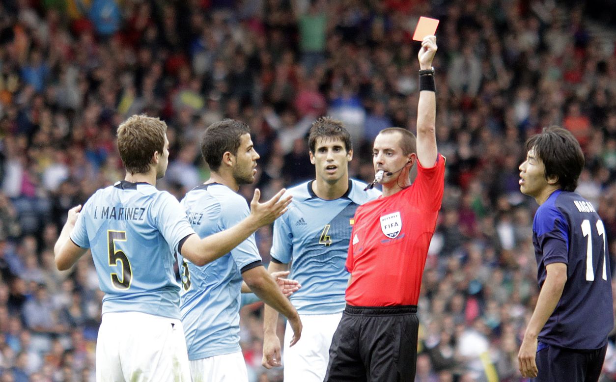Spain's Martinez gets a red card and is ejected during Thursday's match against Japan.