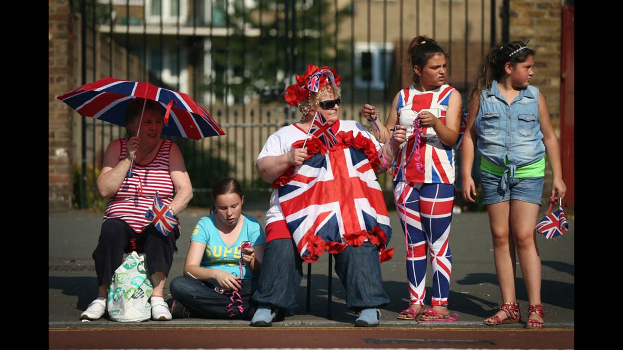  The reunited Spice Girls await the Olympic torch.