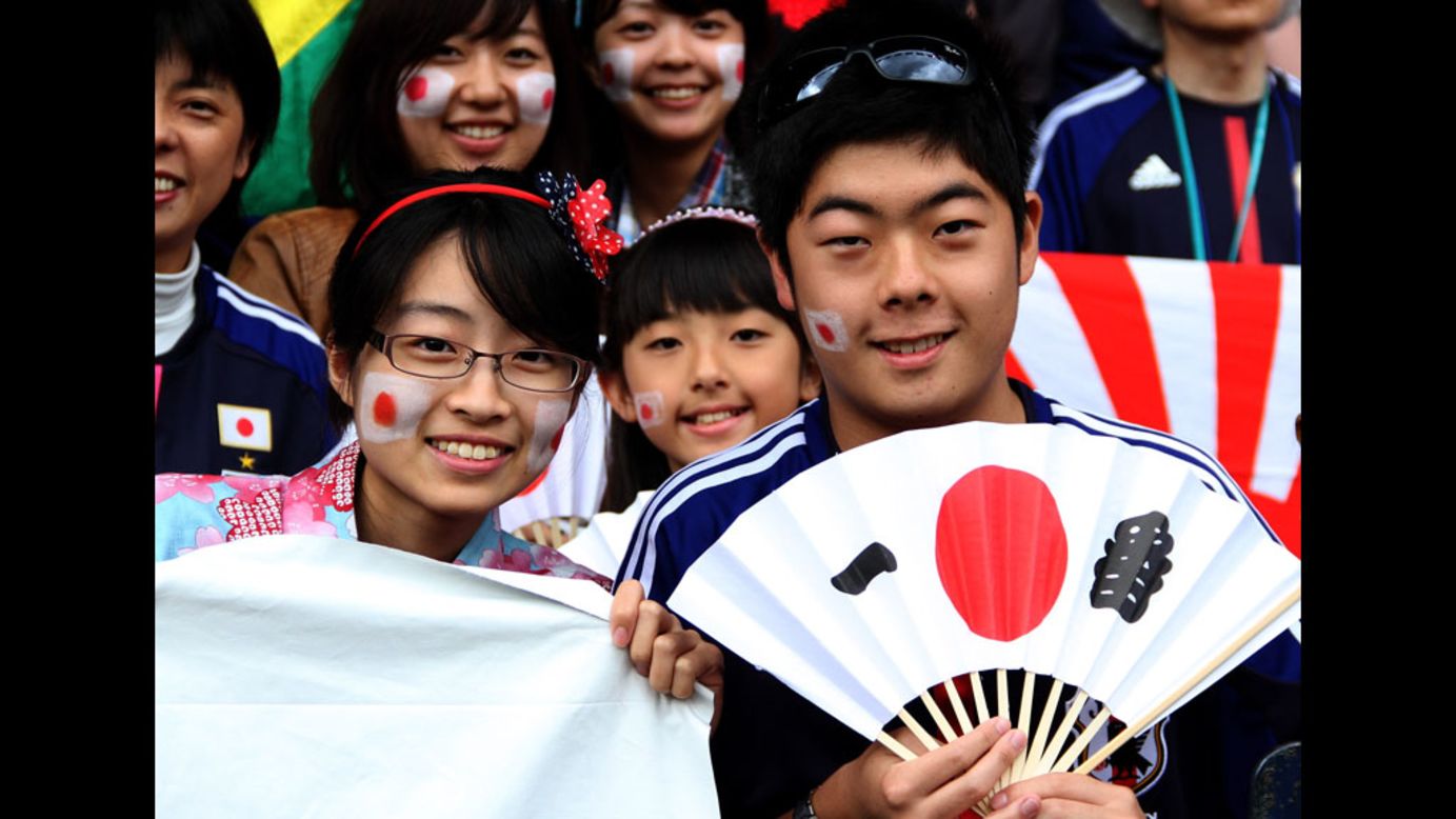 Japanese fans show support for their team during the men's first-round match between Spain and Japan at Hampden Park in Glasgow, Scotland on Thursday.