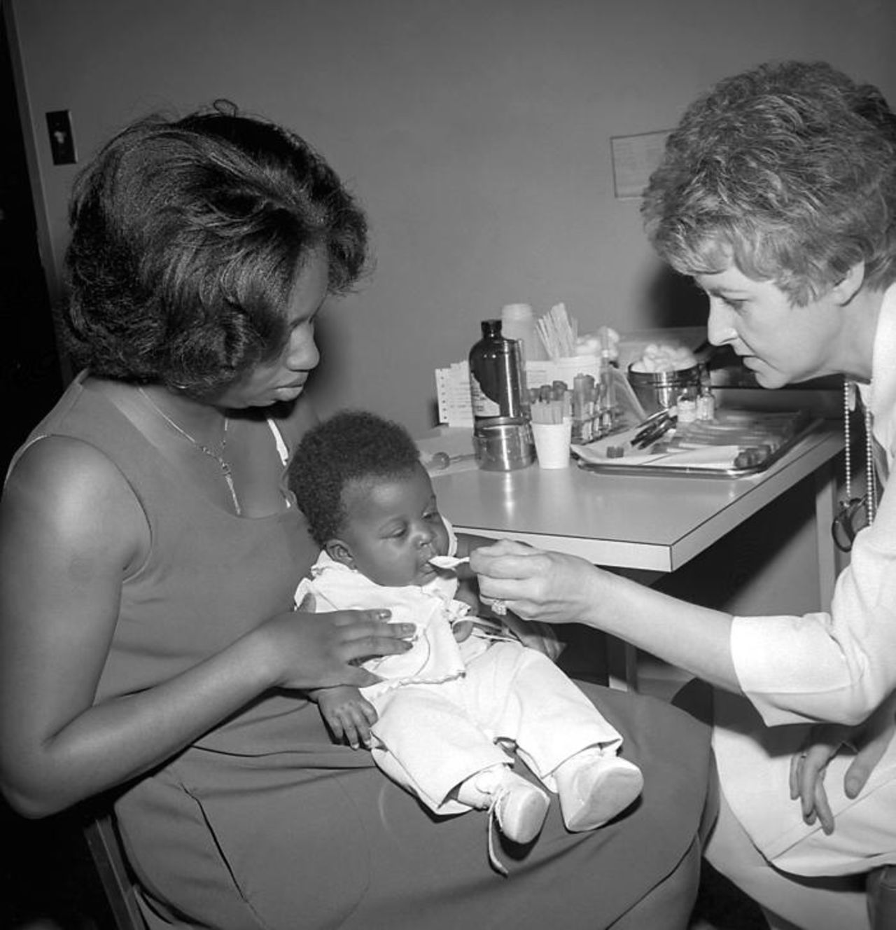 An infant receives an oral polio vaccine at the Well-Baby Clinic in Dekalb County, Georgia, in 1977.