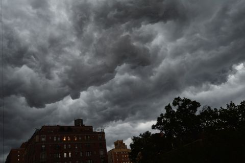 Clouds gather over apartment buildings ahead of a thunderstorm on the east side of Manhattan on Thursday.