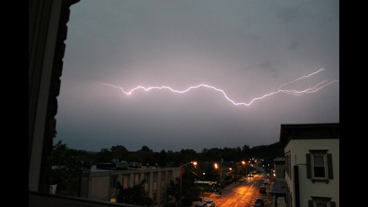 Lightning flashes across the sky Thursday, July 26, in Nyack, New York, in this dramatic photo from CNN iReporter Eric Girard. Storms ripped through the Northeast on Thursday night, unleashing strong winds and knocking out power to hundreds of thousands of customers.
