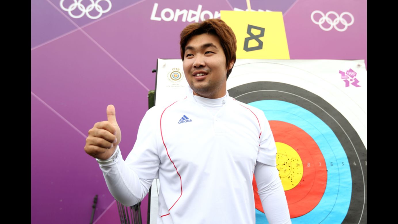 South Korean archer Im Dong Hyun celebrates breaking the first world record of the London Olympics on Friday. The two-time gold medalist, who is classified as legally blind and can't see out of his right eye, bettered his own 72-arrow mark in the qualification competition.