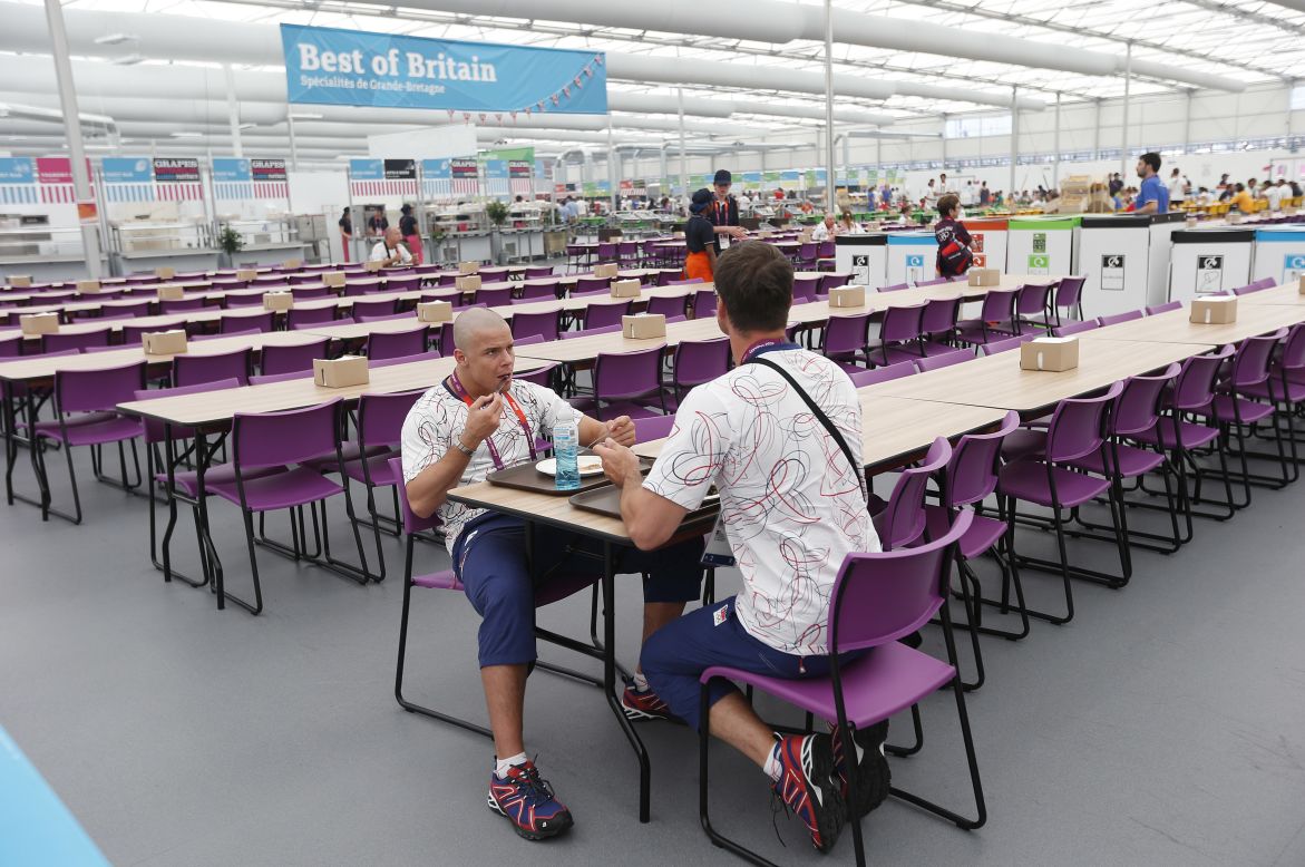The dining hall can seat up to 5,000 people. Here judo team members from the Czech Republic eat before the start of the Games.