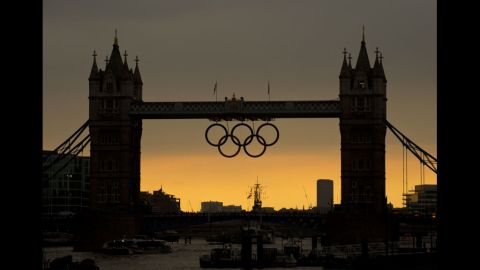 The sun sets behind the Tower Bridge in London hours before the opening ceremony of the 2012 Olympic Games on Friday.