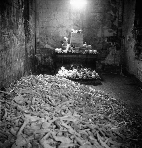 A pile of bones and skulls sits in the Paris Catacombs. Circa 1935