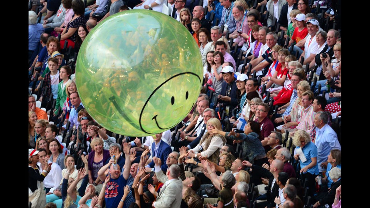 A balloon flies over spectators prior to the opening ceremony.