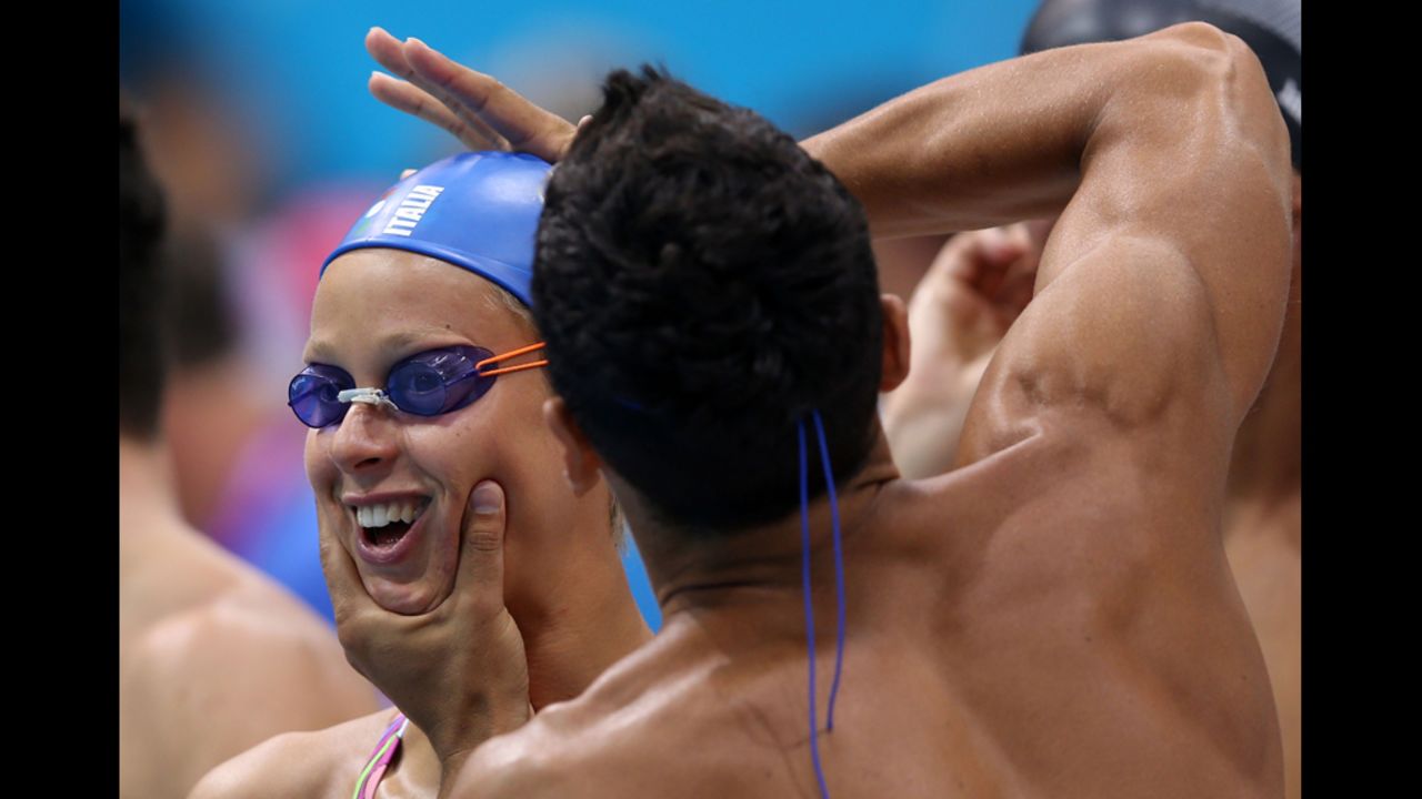  In a traditional pre-race practice, an Italian swimmer is checked for signs of static electricity. 