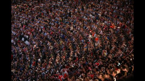 Spectators watch the Opening Ceremony of the London 2012 Olympic Games.