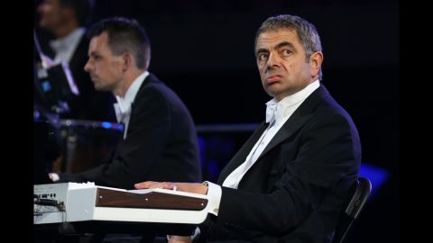 British actor Rowan Atkinson in his role as Mr. Bean plays in the orchestra. 