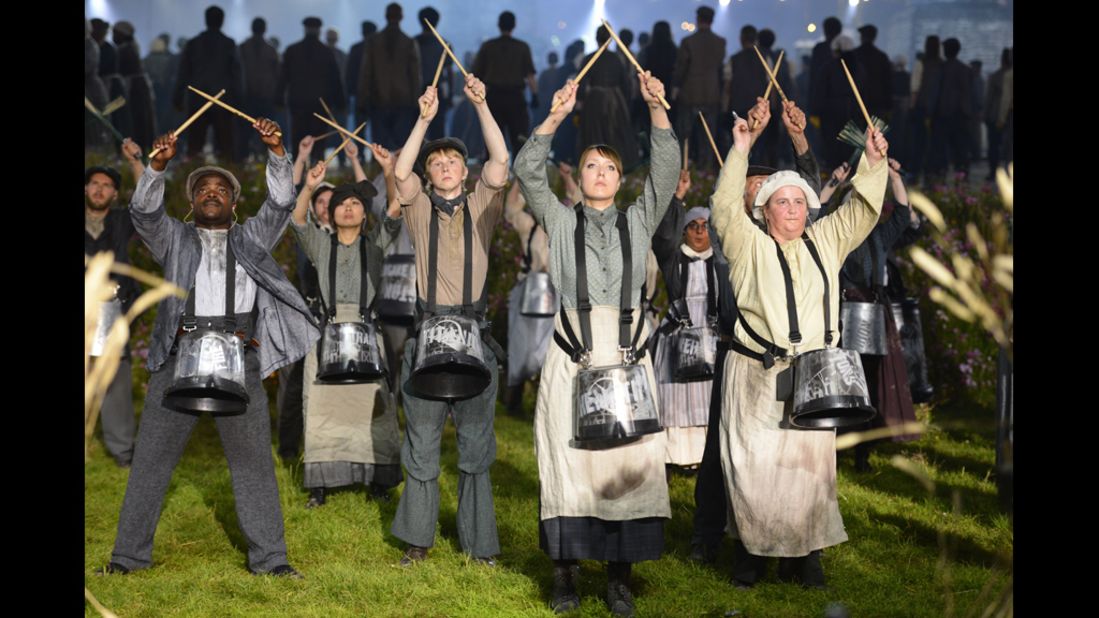 Actors perform during the British meadow scene during the opening ceremony.