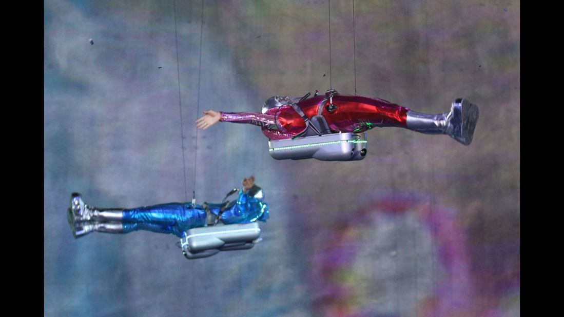 Performers with jetpacks take part in the opening ceremony.