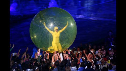 A performer in a giant ball is passed around during the opening ceremony.